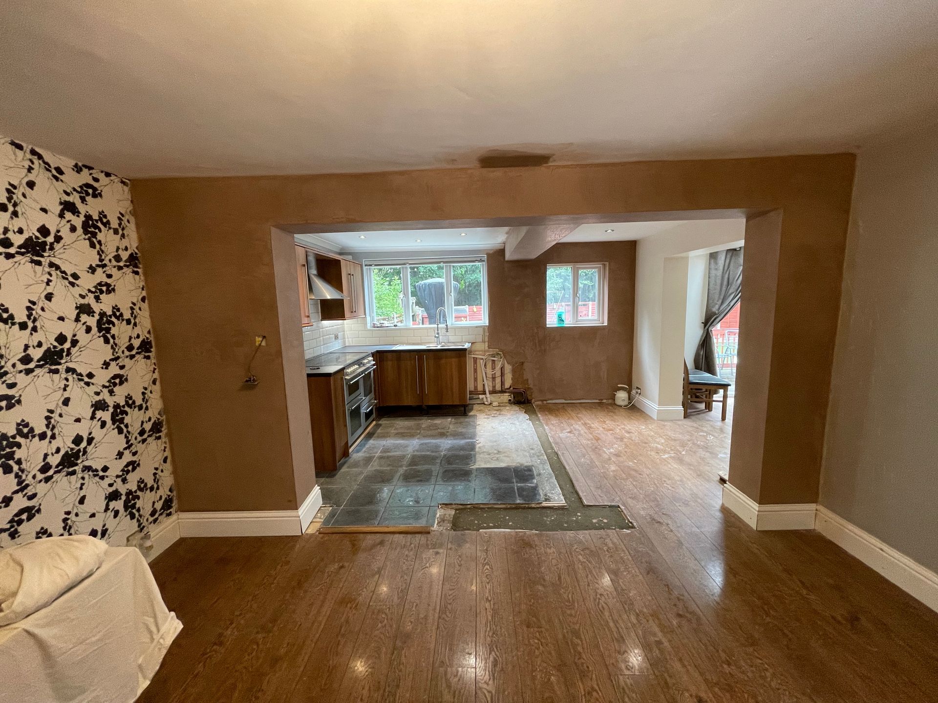 Multi-point structural steel installation enabling a complete open-plan ground floor reconfiguration.