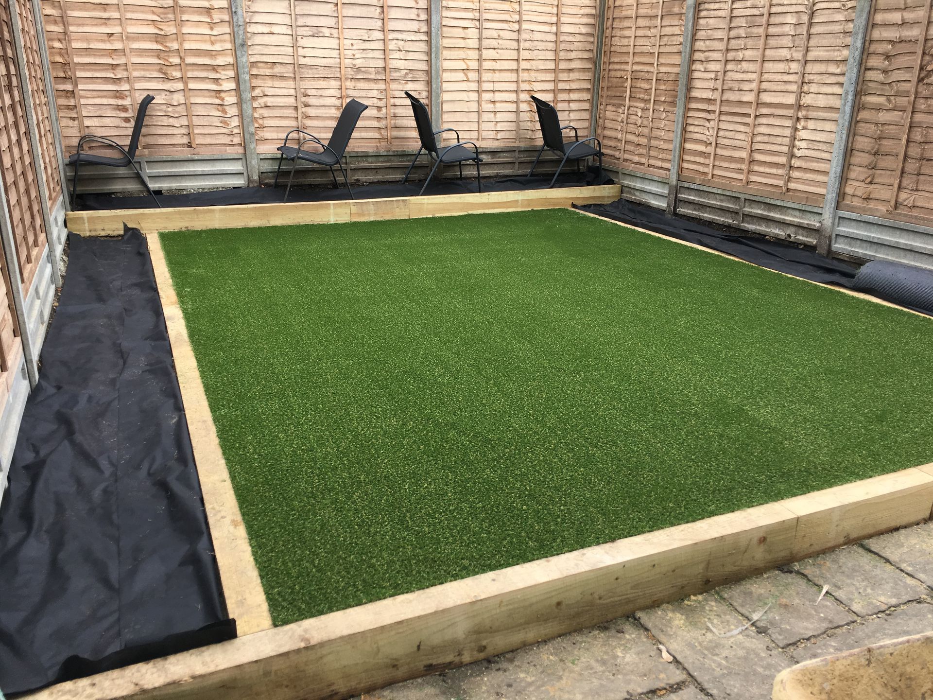 Garden landscaping to complement the new extension — patio, lawn, and planting scheme.