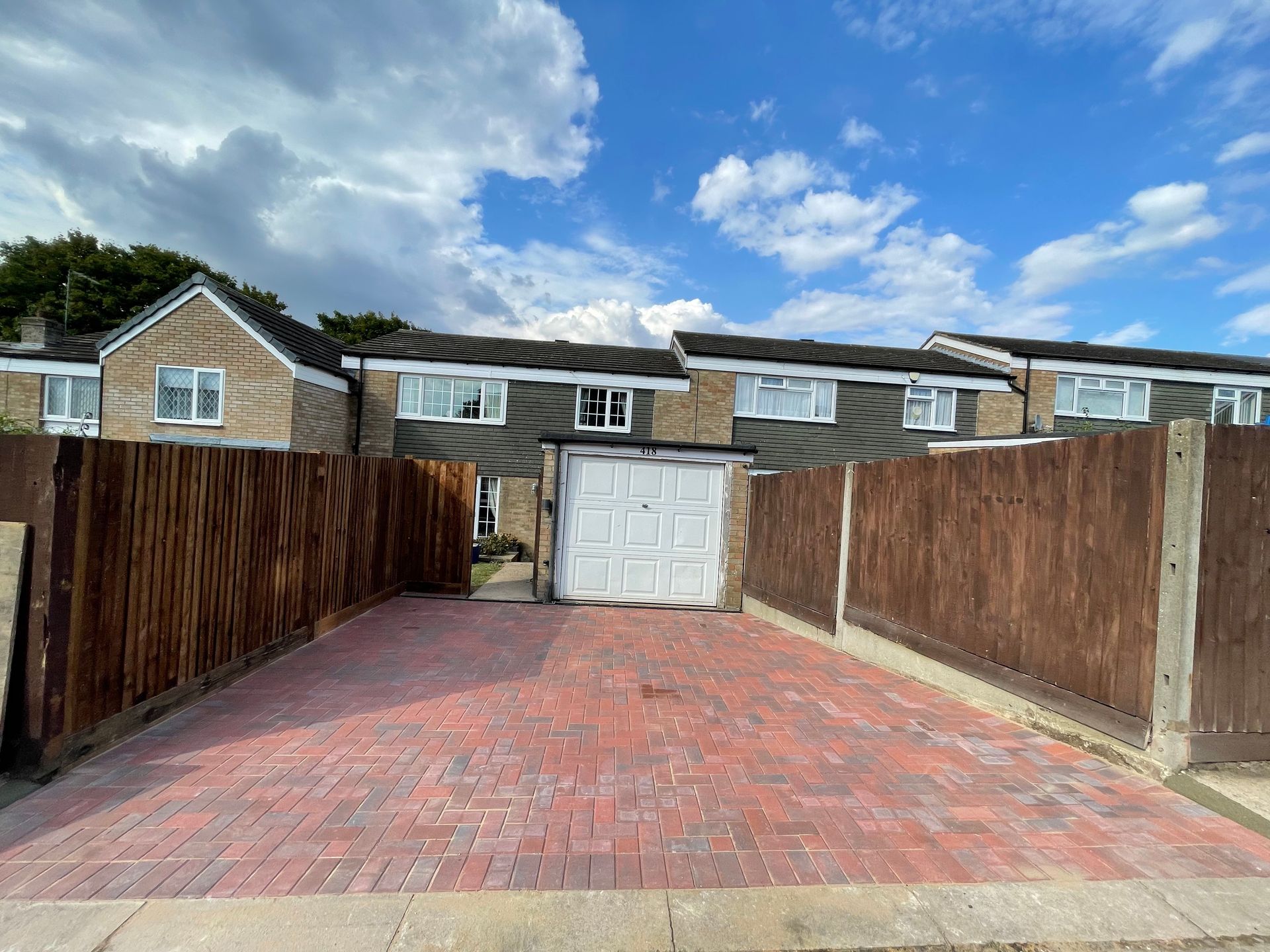 New tarmac and block paving driveway with drainage solution and smart border finish.